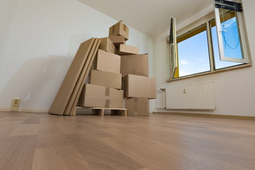 Packed moving boxes and furniture ready for transport in Richmond