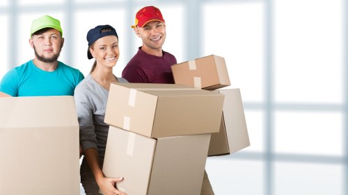 Professional movers handling a removal service with attention to access and safety.