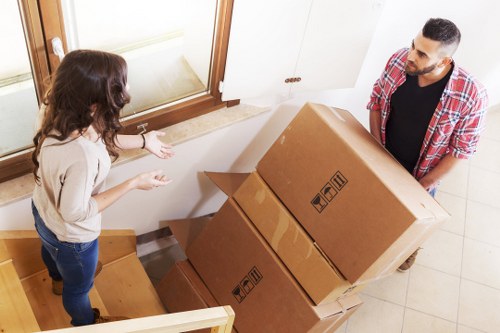 Removal professionals protecting furniture and property during packing and loading